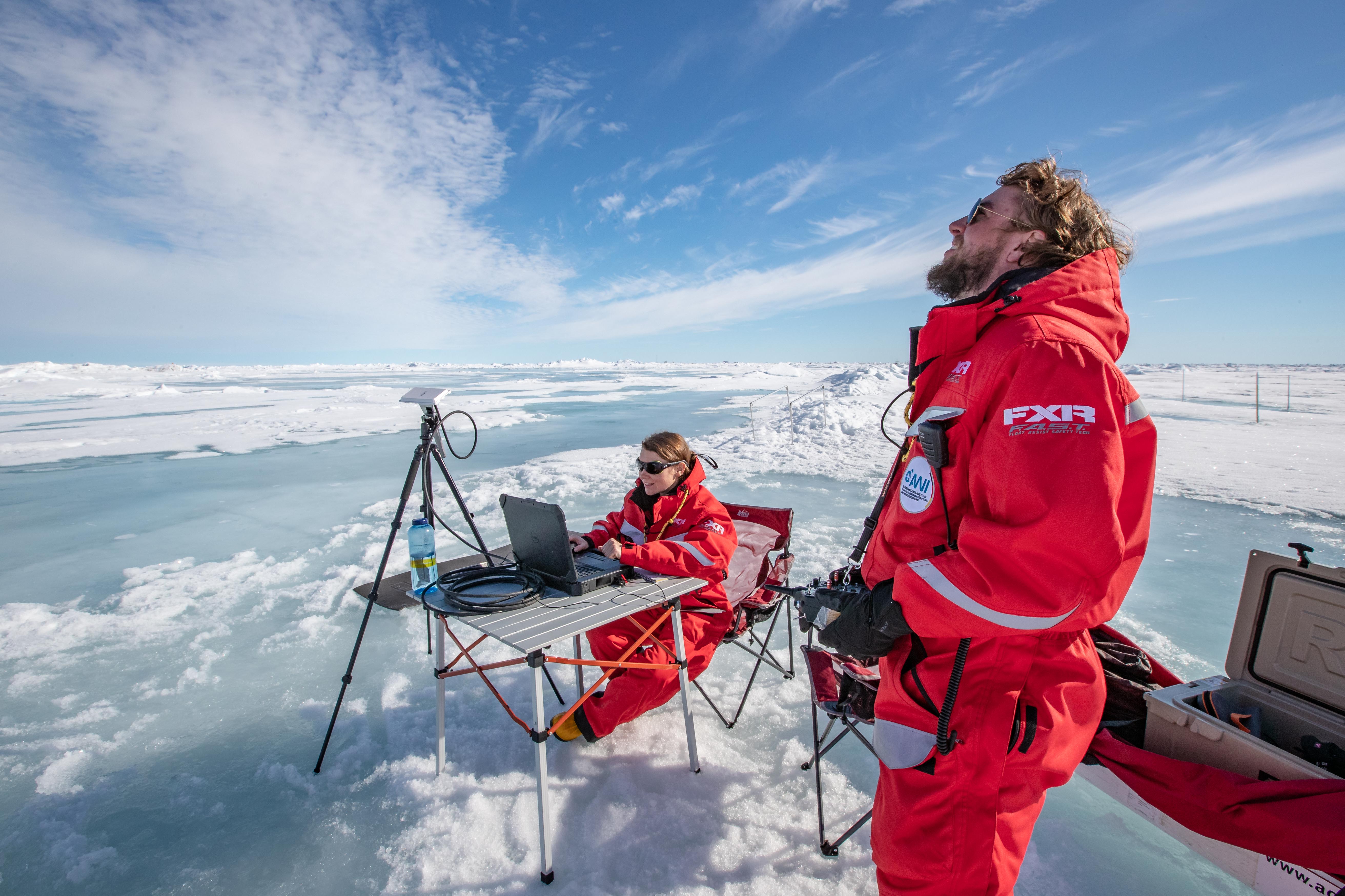 Scientists flying drones on the ice; Photo credit: Lianna Nixon