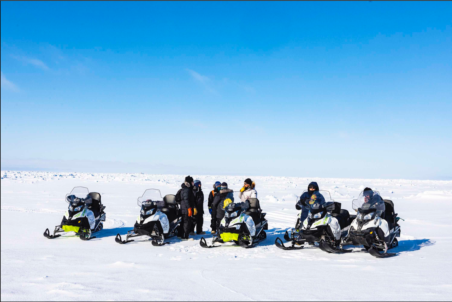 Scientists on snowmobiles