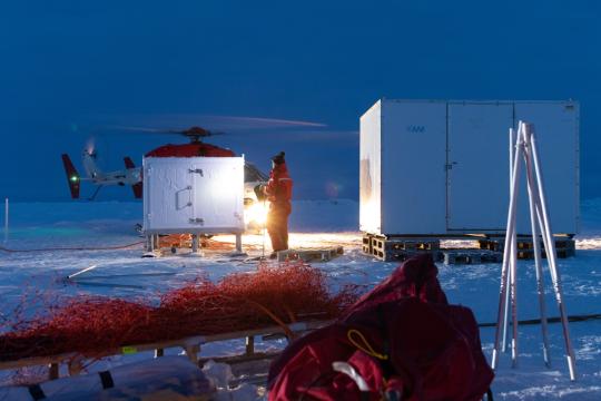 scientists and equipment on ice