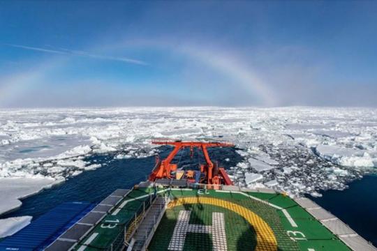 A rainbow forms over the Polarstern as the ship docks at its final position. Photo: Lianna Nixon/CIRES