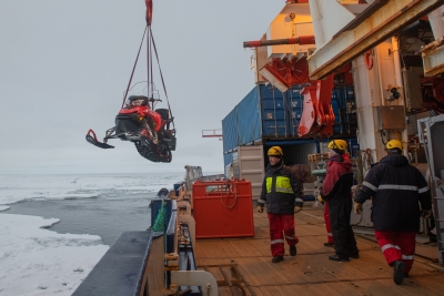 Skidoo being lifted onto the ice
