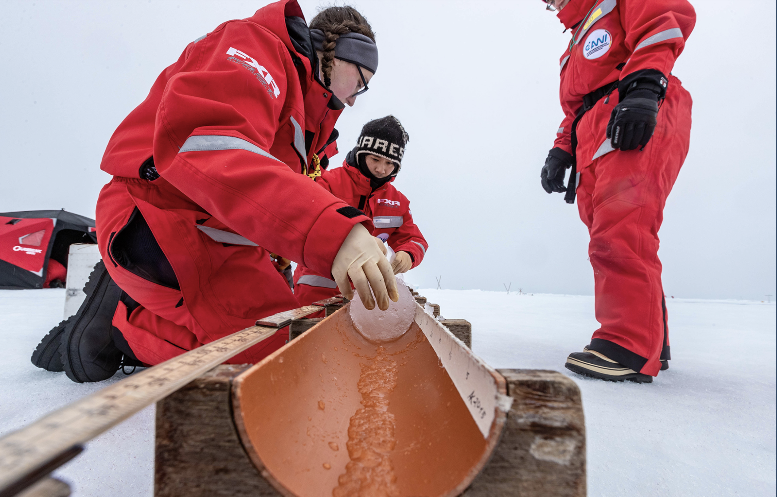Scientists collecting an ice core