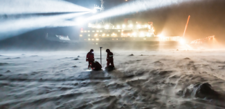 scientists in blowing snow, dark