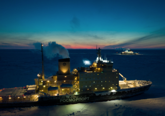 Polarstern and Kapitan Dranitsyn sit within reach. Photo: Manuel Ernst and Dieter Stumer Two ships parked in the Arctic ice at twilight