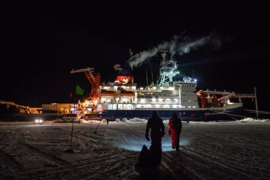 Researchers with the MOSAiC polar expedition inspect the ice in November. Life now feels surreal as they socialize normally, trying to imagine the global pandemic shutdown. Esther Horvath/Alfred Wegener Institute