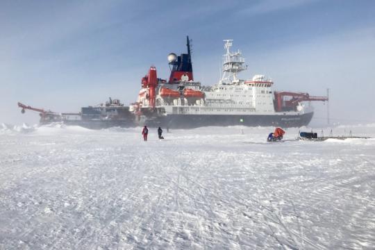 As calm conditions gradually return after a couple of days of windy conditions, Polarstern is visible through some blowing snow at ground level.