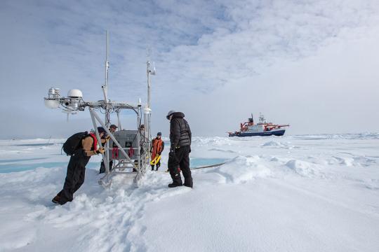 ATMOS and Logistics team finally reach the new destination of the flux sled at the first year ice site. Credit: Lianna Nixon